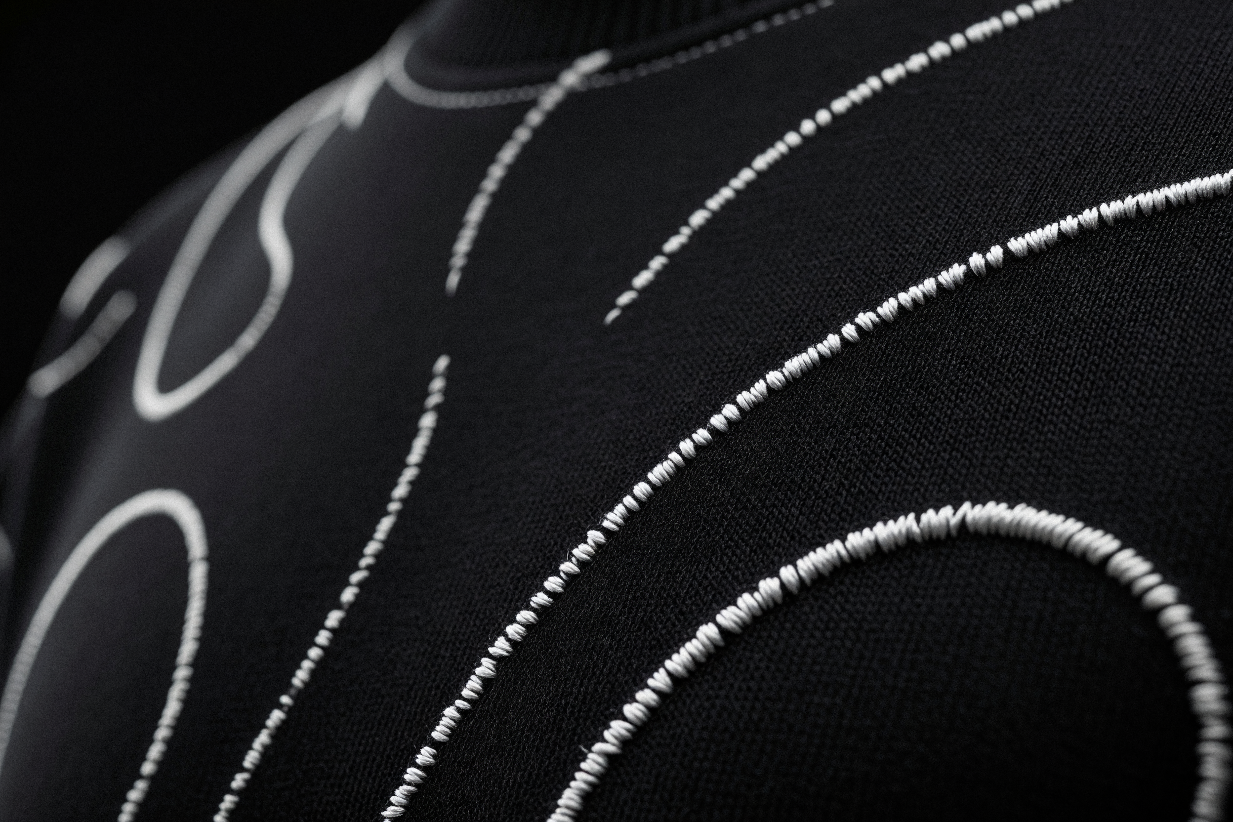 Bone Line Pullover, raised stitch detail — macro